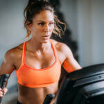 Woman Exercising on Elliptical Cross Trainer